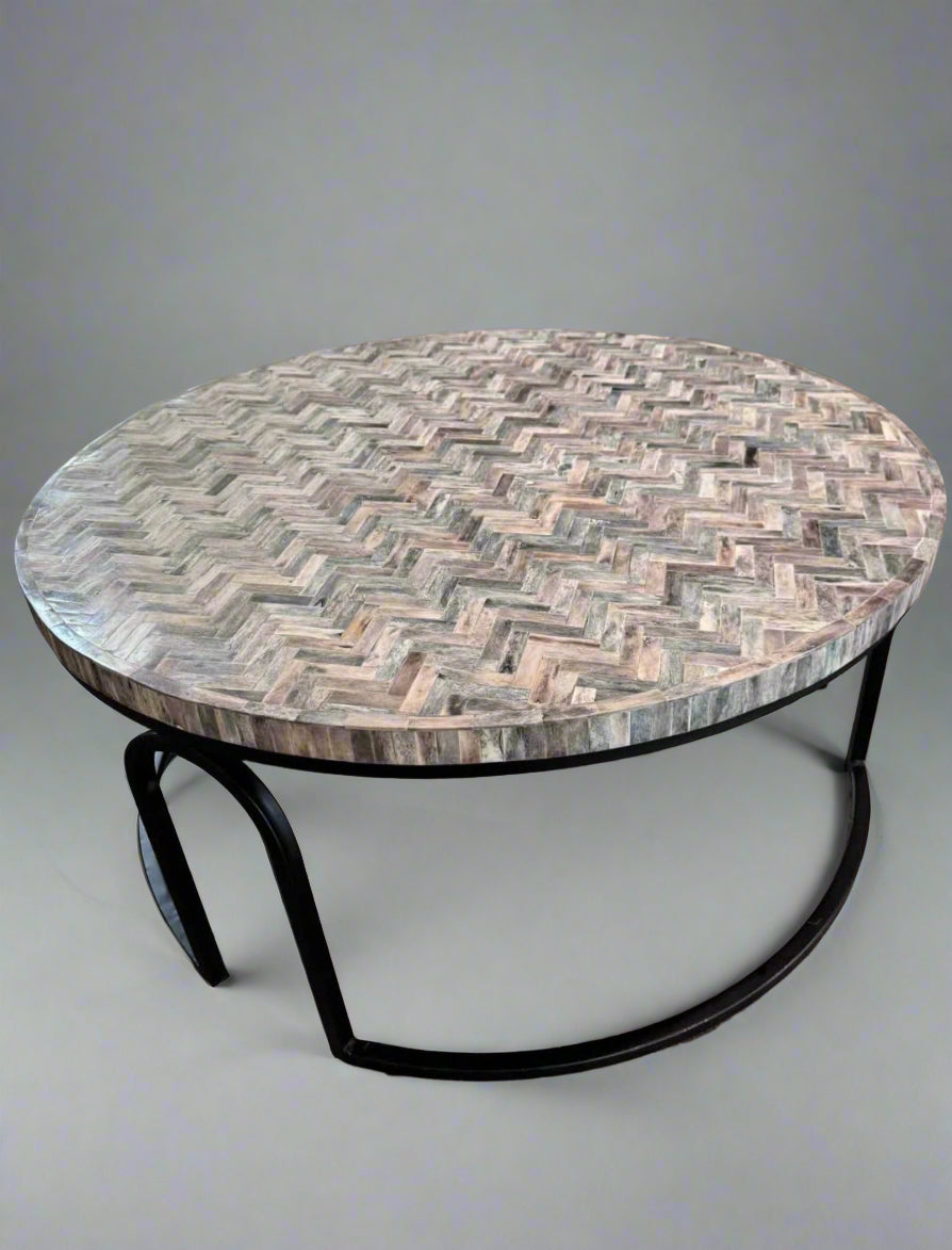 Vintage Charm Chevron Coffee Table with round wooden inlay top and slender metal base for modern elegance.