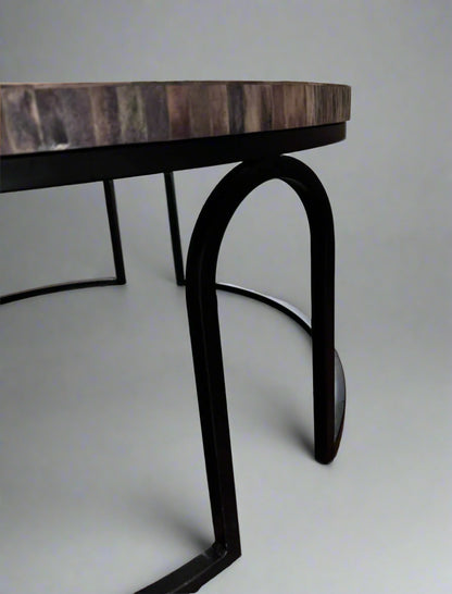 Vintage charm chevron coffee table with wooden inlay top and slender metal frame, showcasing elegant design details.